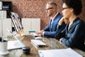 Businesspeople Video Conferencing With Their Partner On Computer