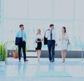 Businesspeople walking in the corrido. Royalty Free Stock Photo