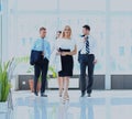 Businesspeople walking in the corrido. Royalty Free Stock Photo