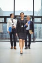 Businesspeople walking together with file Royalty Free Stock Photo