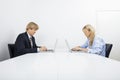 Businesspeople working on laptops in office Royalty Free Stock Photo