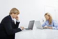 Businesspeople working on laptops in office Royalty Free Stock Photo