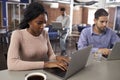 Businesspeople Working On Laptops In Office Coffee Bar Royalty Free Stock Photo