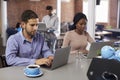 Businesspeople Working On Laptops In Office Coffee Bar Royalty Free Stock Photo