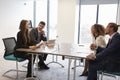 Businesspeople Working Together At Desk In Modern Office Royalty Free Stock Photo