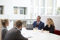 Businesspeople Working Together At Desk In Modern Office Royalty Free Stock Photo