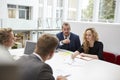 Businesspeople Working Together At Desk In Modern Office Royalty Free Stock Photo