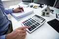 Businessperson Calculating Property Tax Royalty Free Stock Photo