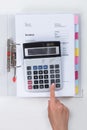 Businessperson Calculating Tax With Calculator Royalty Free Stock Photo