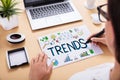 Businessperson Drawing Trends Chart On Office Desk