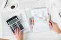 Businessperson Examining Invoice With Magnifying Glass Royalty Free Stock Photo