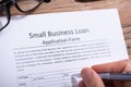 Businessperson Filling Small Business Loan Application Form Royalty Free Stock Photo