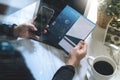 Businessperson Hands holding New Gift Card or Credit card,digital tablet computer dock keyboard,smart phone on marble