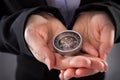 Businessperson holding compass