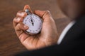 Businessperson Holding Stop Watch Royalty Free Stock Photo