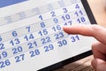 Businessperson Looking At Calendar On Tablet