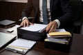 businessperson, meticulously organizing and filing documents for upcoming business trip