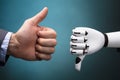 Businessperson And Robot Showing Thumb Up And Thumb Down Sign Royalty Free Stock Photo