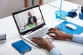 Businessperson`s Videoconferencing With Male Colleague On Laptop Royalty Free Stock Photo