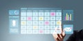 Businessperson selecting dates on digital calendar interface