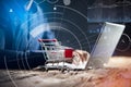 Businessperson With Shopping Cart And Laptop Royalty Free Stock Photo