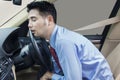 Businessperson sleeping in the car Royalty Free Stock Photo