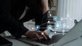 Businessperson Using Laptop with Digital Connectivity Icons Representing Technology, Networking, Productivity, and Data Royalty Free Stock Photo