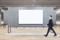 Businessperson walking in gallery interior