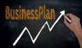 Businessplan and graph is written by hand on blackboard Royalty Free Stock Photo