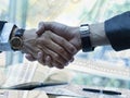 Businessteam of deal which handshake man and Success concept of handshaking after successful deal job While dollars banknote Royalty Free Stock Photo