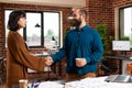 Businessteam shaking hands during company meeting in startup office