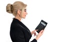 Businesswoman accountant in a black suit clicks on a calculator to calculate tax financial expenses