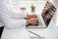 Businesswoman or accountant. Work in a creative and modern room.The laptop is on the table. A business person resting his hand on