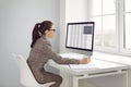 Businesswoman or accountant working with spreadsheets on modern desktop computer Royalty Free Stock Photo