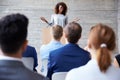 Businesswoman Addressing Delegates At Conference