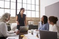 Businesswoman addressing female colleagues in a meeting Royalty Free Stock Photo