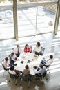 Businesswoman addressing meeting, elevated view, vertical