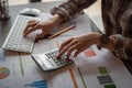 Businesswoman analyzing financial reports with calculator and typing on modern computer keyboard at office. Business analytics Royalty Free Stock Photo