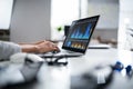 Businesswoman Analyzing Graph On Laptop Royalty Free Stock Photo