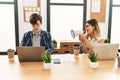 Businesswoman angry shouting her partner using megaphone at the office Royalty Free Stock Photo