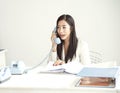 Businesswoman answering with costomer by telephone at office Royalty Free Stock Photo