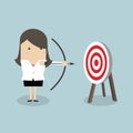 Businesswoman with archery bow and target. Royalty Free Stock Photo