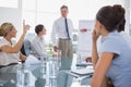 Businesswoman asking something during a meeting