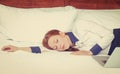 Businesswoman asleep on the bed, hotel or domestic room