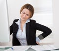 Businesswoman with back pain Royalty Free Stock Photo