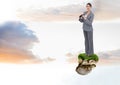 Businesswoman with binoculars on floating rock platform in sky Royalty Free Stock Photo