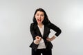 Businesswoman in black formal jacket white shirt pointing at camera with an angry aggressive expression looking like a furious, Royalty Free Stock Photo