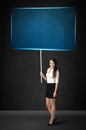 Businesswoman with blue board Royalty Free Stock Photo