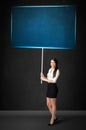 Businesswoman with blue board Royalty Free Stock Photo