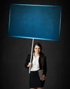 Businesswoman with blue board Royalty Free Stock Photo